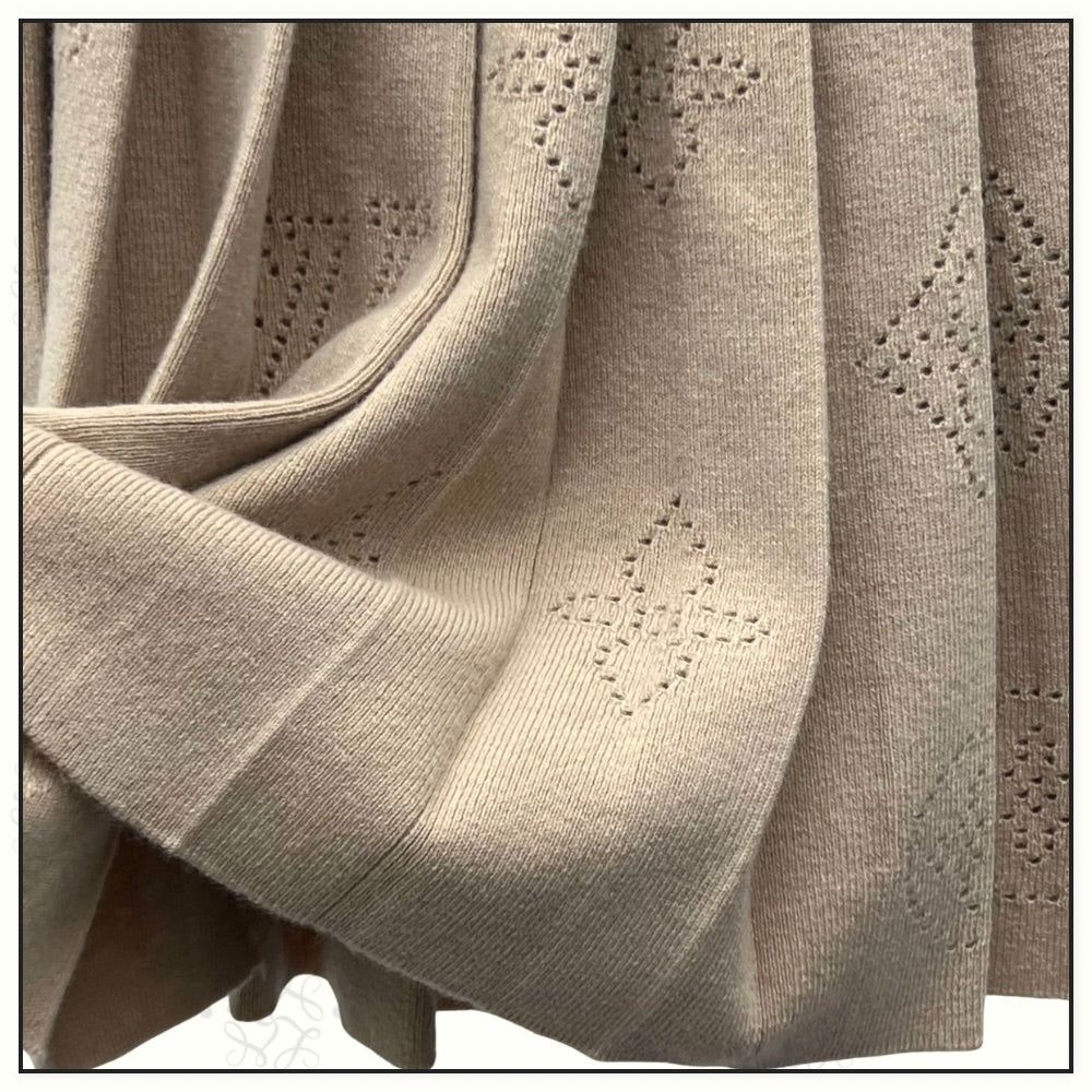 WOOL CASHMERE MAHINA CARDIGAN & PLEATED SKIRT