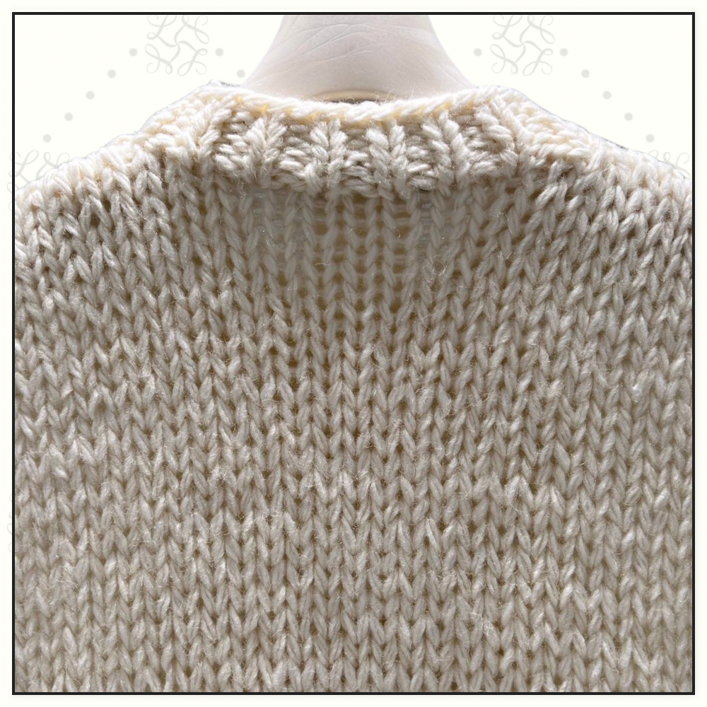 CABLE KNIT VEST WITH FLORAL APPLIQUÉS