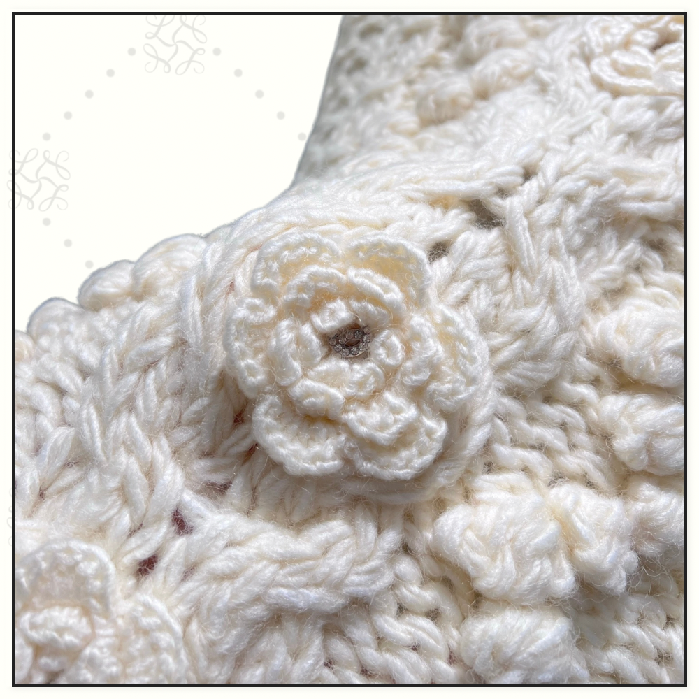 CABLE KNIT VEST WITH FLORAL APPLIQUÉS