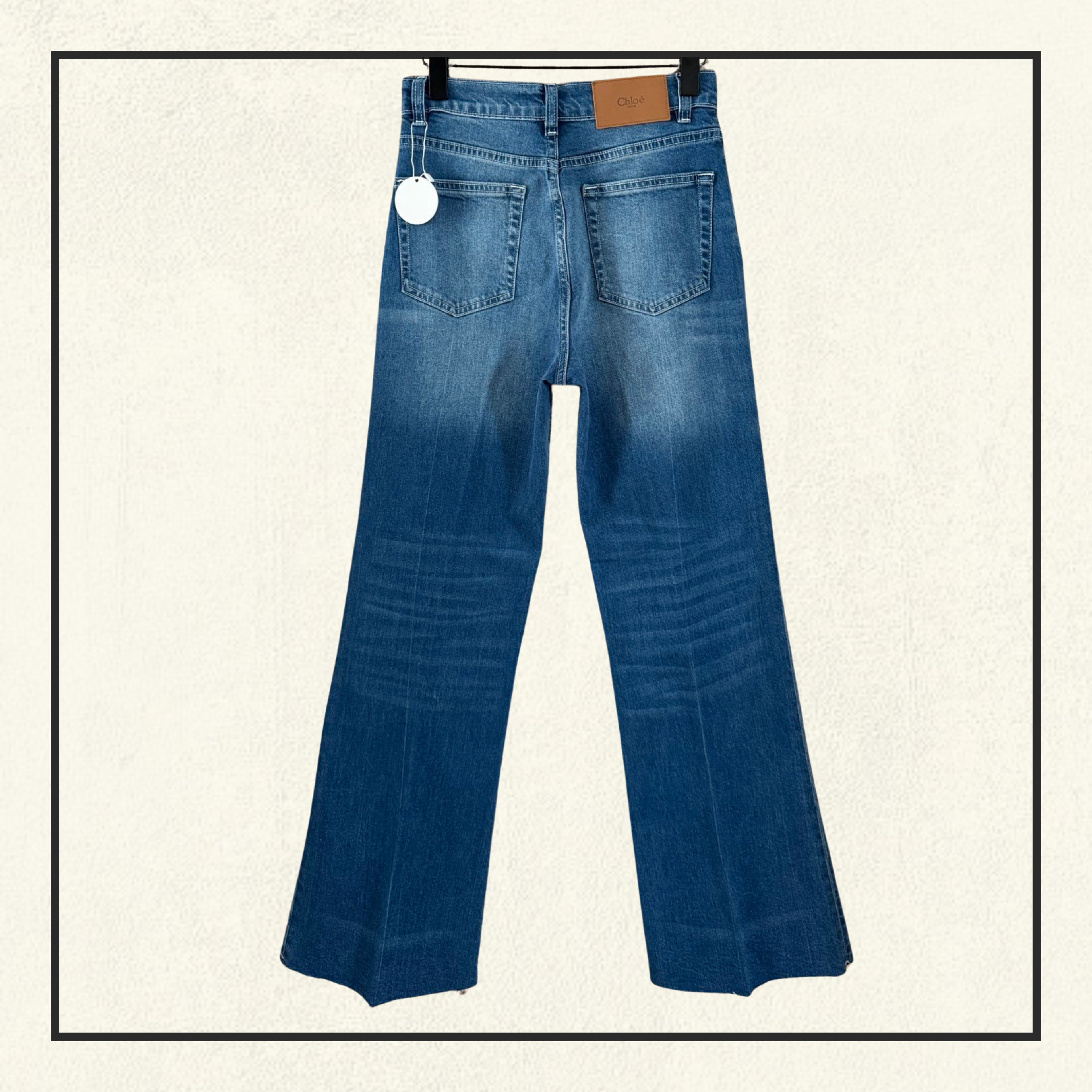 FRAYED FLARED HIGH RISE JEANS