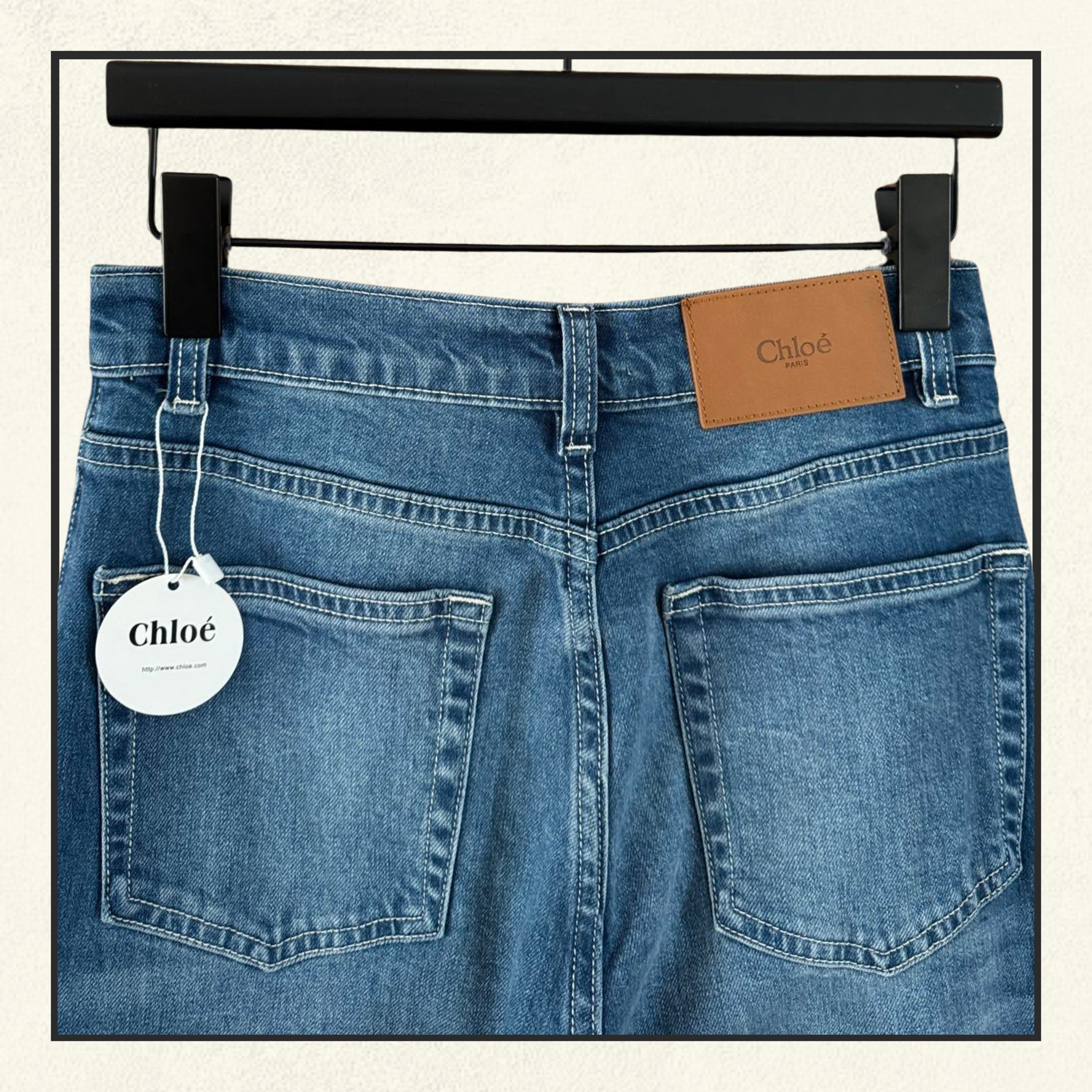 FRAYED FLARED HIGH RISE JEANS