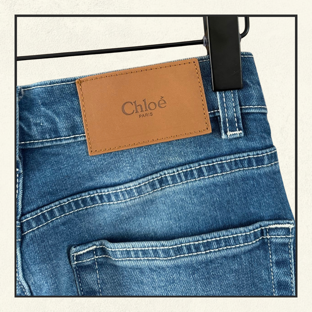 FRAYED FLARED HIGH RISE JEANS